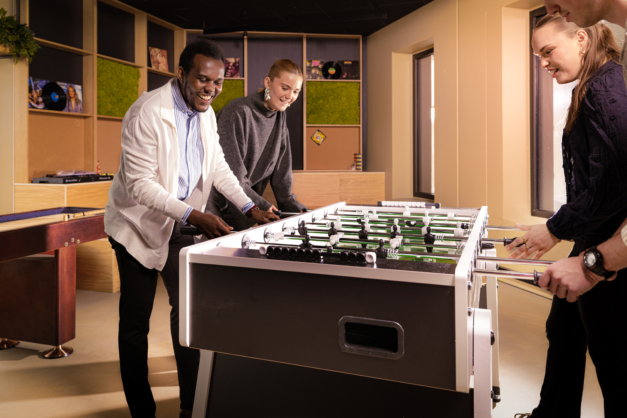 Two people playing fussball
